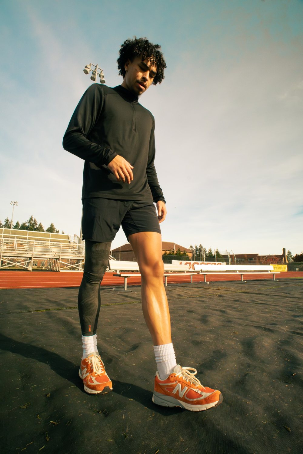 Jayo on a track in an Incrediwear leg sleeve and orange sneakers